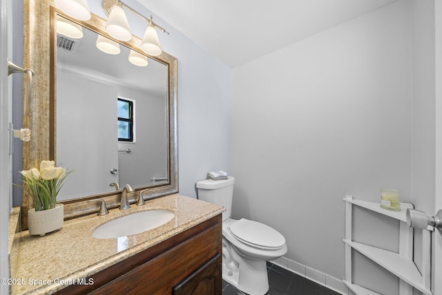 255 S Tropical Trl Unit B3, Merritt Island, FL 32952 - half bath with toilet, tile patterned floors, and vanity