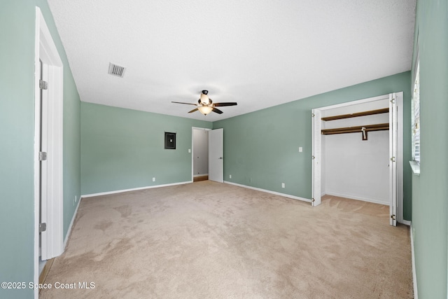 255 S Tropical Trl Unit B3, Merritt Island, FL 32952 - unfurnished bedroom featuring carpet floors, baseboards, and a closet