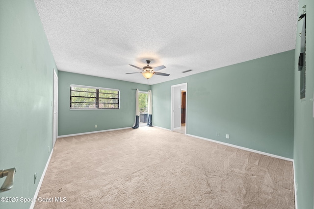 255 S Tropical Trl Unit B3, Merritt Island, FL 32952 - carpeted spare room with ceiling fan, a textured ceiling, and baseboards