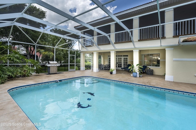 175 Stewart Dr, Merritt Island, FL 32952 - swimming pool featuring a patio, area for grilling, and a lanai