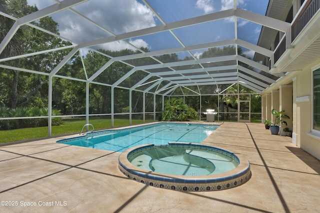 175 Stewart Dr, Merritt Island, FL 32952 - view of swimming pool with a patio area, a pool with connected hot tub, and a lanai