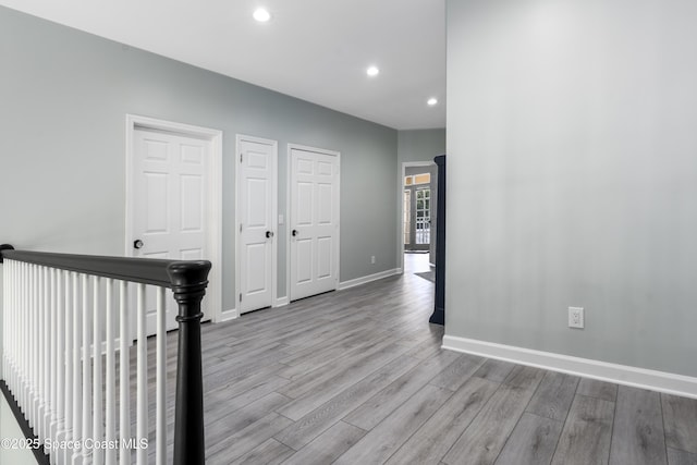 175 Stewart Dr, Merritt Island, FL 32952 - hallway with wood finished floors, recessed lighting, and baseboards