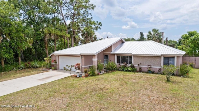 326 Brescia St NE, Palm Bay, FL 32907 - single story home featuring an attached garage, stucco siding, driveway, and metal roof