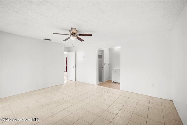 326 Brescia St NE, Palm Bay, FL 32907 - unfurnished room featuring a ceiling fan and a textured ceiling