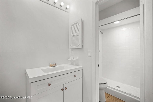 326 Brescia St NE, Palm Bay, FL 32907 - bathroom featuring toilet, a stall shower, vanity, and tile patterned floors