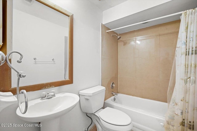 326 Brescia St NE, Palm Bay, FL 32907 - full bathroom featuring shower / tub combo with curtain, toilet, and a sink