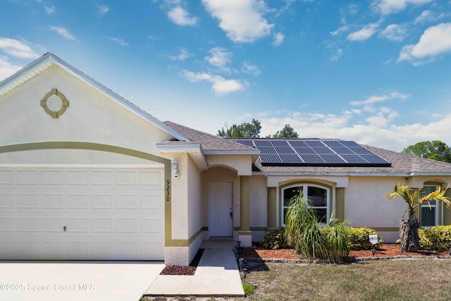 5230 Everett St, Cocoa, FL 32927 - ranch-style house with stucco siding, solar panels, a shingled roof, a garage, and concrete driveway