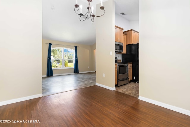5230 Everett St, Cocoa, FL 32927 - unfurnished living room with a chandelier, dark wood-style flooring, and baseboards