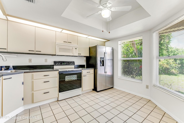 950 Vanessa Ct Unit F, Port Orange, FL 32127 - kitchen featuring white appliances, a sink, dark countertops, ceiling fan, and baseboards