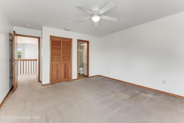 950 Vanessa Ct Unit F, Port Orange, FL 32127 - unfurnished bedroom featuring light carpet, baseboards, and a closet