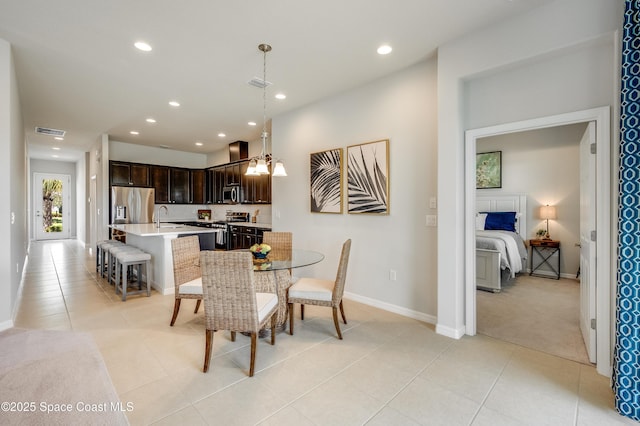 2679 Avalonia Dr, Melbourne, FL 32940 - dining space featuring light tile patterned flooring, recessed lighting, and light carpet