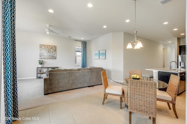 2679 Avalonia Dr, Melbourne, FL 32940 - dining room featuring ceiling fan, recessed lighting, a chandelier, and light carpet