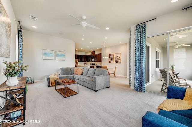2679 Avalonia Dr, Melbourne, FL 32940 - living area with a ceiling fan, light colored carpet, and recessed lighting