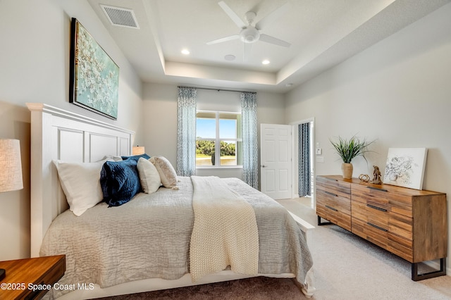 2679 Avalonia Dr, Melbourne, FL 32940 - bedroom featuring light carpet, recessed lighting, a ceiling fan, and a raised ceiling