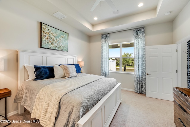 2679 Avalonia Dr, Melbourne, FL 32940 - bedroom featuring light carpet, a tray ceiling, recessed lighting, and ceiling fan