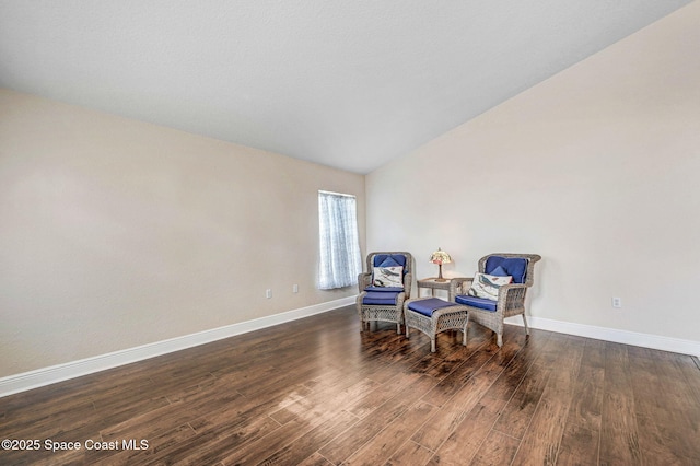 4040 Estancia Way, Melbourne, FL 32934 - living area with wood finished floors, baseboards, and vaulted ceiling