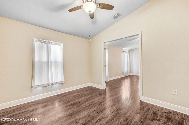 4040 Estancia Way, Melbourne, FL 32934 - spare room featuring lofted ceiling, ceiling fan, wood finished floors, and baseboards