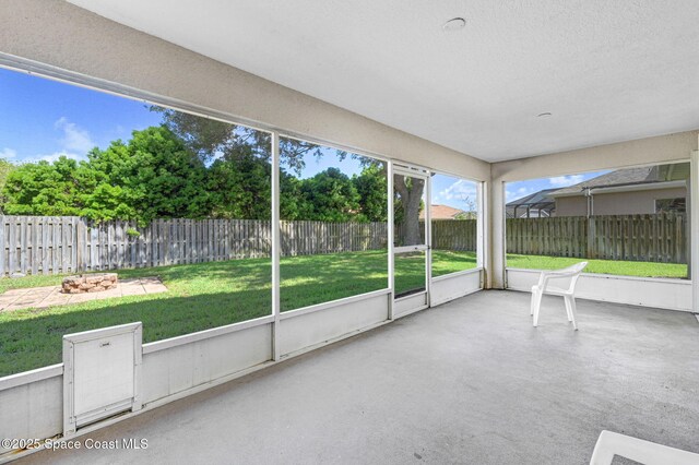 4040 Estancia Way, Melbourne, FL 32934 - unfurnished sunroom featuring a fire pit