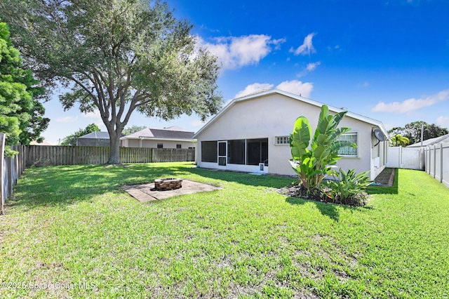 4040 Estancia Way, Melbourne, FL 32934 - back of house with an outdoor fire pit and stucco siding