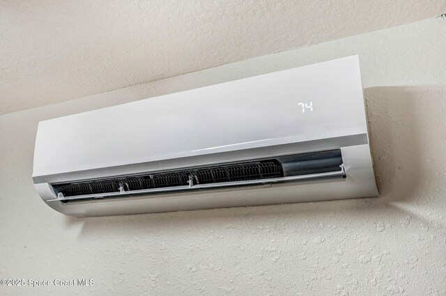 4040 Estancia Way, Melbourne, FL 32934 - detailed view of a wall mounted AC and a textured wall