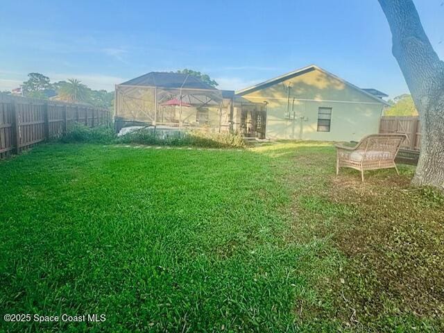 497 Erma Ct NE, Palm Bay, FL 32907 - view of yard with glass enclosure