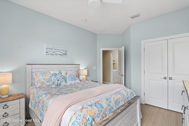 bedroom with light carpet, a closet, and ceiling fan