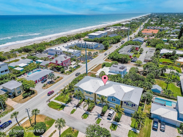 aerial view of waterfront with a beach