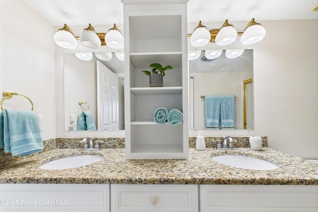 full bathroom with double vanity and an enclosed shower