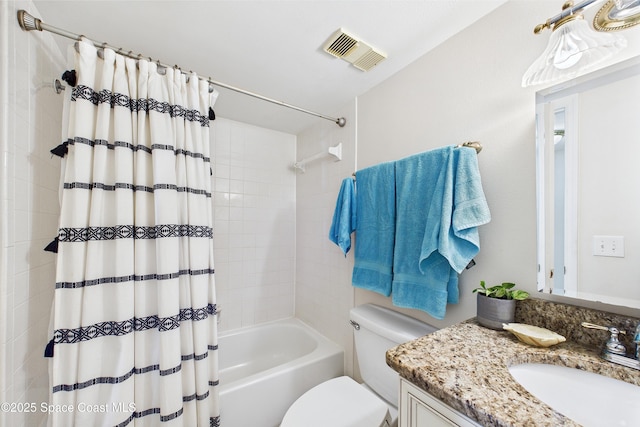 bathroom with toilet, vanity, and shower / bath combo
