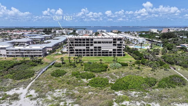 aerial view of a nearby body of water and apartment complex