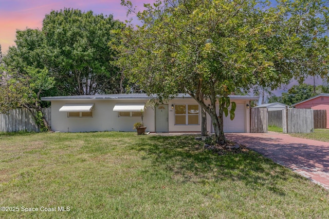 1751 5th Ct, Vero Beach, FL 32960 - single story home with decorative driveway, a garage, and metal roof
