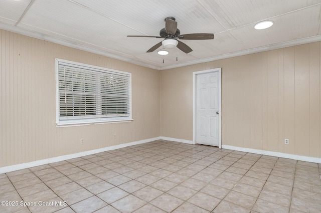 1751 5th Ct, Vero Beach, FL 32960 - empty room with a ceiling fan, ornamental molding, wooden walls, and baseboards