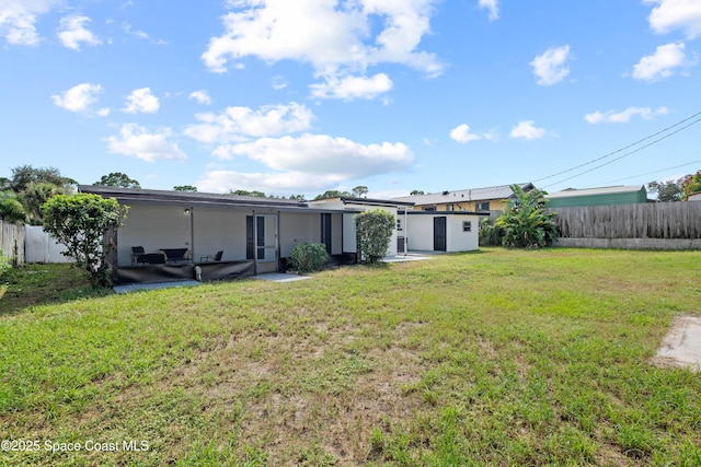 1108 Vineland St, Cocoa, FL 32927 - back of house with a patio, an outbuilding, and a storage unit