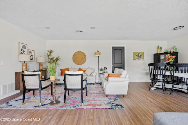 1108 Vineland St, Cocoa, FL 32927 - living area featuring wood finished floors, baseboards, and a textured ceiling