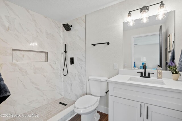1108 Vineland St, Cocoa, FL 32927 - full bath with vanity, toilet, and a marble finish shower
