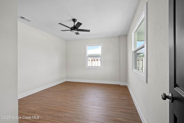 1108 Vineland St, Cocoa, FL 32927 - spare room with wood finished floors, ceiling fan, and baseboards