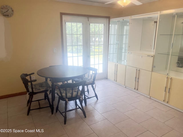 dining room featuring a ceiling fan and light tile patterned floors