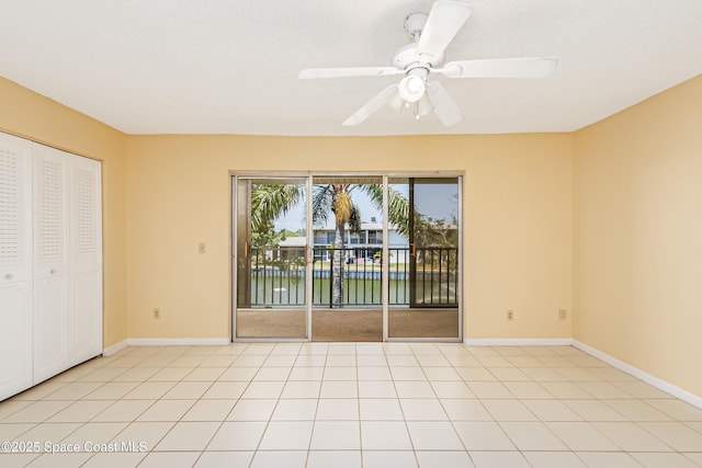 411 Dove Ln Unit 6-11, Satellite Beach, FL 32937 - unfurnished bedroom featuring access to exterior, a water view, and baseboards