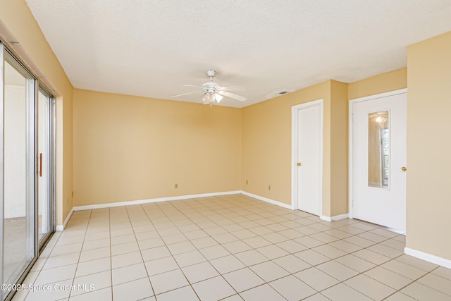 411 Dove Ln Unit 6-11, Satellite Beach, FL 32937 - empty room with ceiling fan, baseboards, a textured ceiling, and light tile patterned flooring