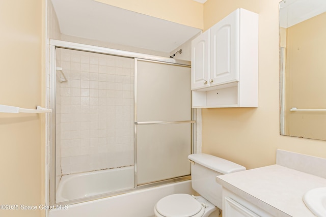 411 Dove Ln Unit 6-11, Satellite Beach, FL 32937 - full bathroom with vanity, toilet, and bath / shower combo with glass door