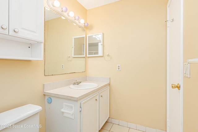 411 Dove Ln Unit 6-11, Satellite Beach, FL 32937 - half bath with toilet, tile patterned floors, vanity, and baseboards