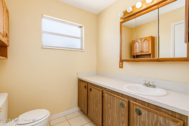 411 Dove Ln Unit 6-11, Satellite Beach, FL 32937 - bathroom with toilet, tile patterned floors, vanity, and baseboards