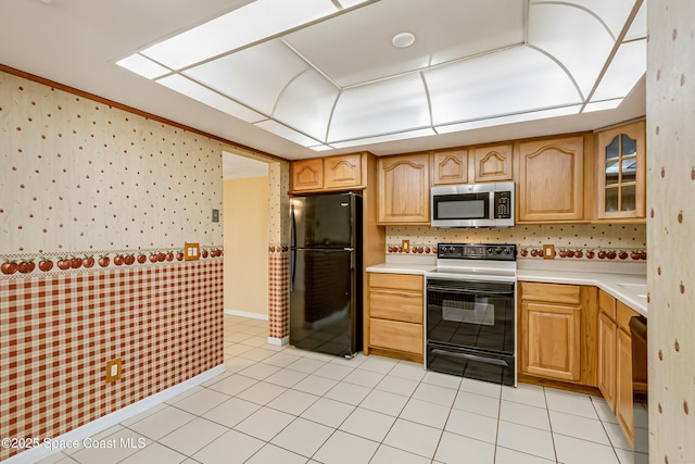 411 Dove Ln Unit 6-11, Satellite Beach, FL 32937 - kitchen with black appliances, wallpapered walls, light countertops, glass insert cabinets, and light tile patterned floors