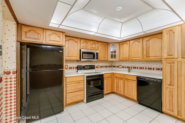 411 Dove Ln Unit 6-11, Satellite Beach, FL 32937 - kitchen featuring black appliances, light countertops, wallpapered walls, glass insert cabinets, and light tile patterned flooring