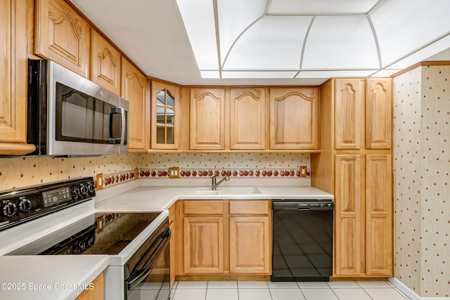 411 Dove Ln Unit 6-11, Satellite Beach, FL 32937 - kitchen with stainless steel microwave, electric range, black dishwasher, a sink, and wallpapered walls