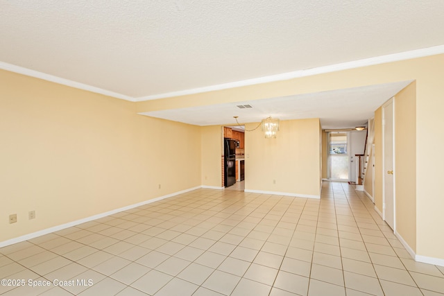 411 Dove Ln Unit 6-11, Satellite Beach, FL 32937 - empty room with light tile patterned floors, a chandelier, baseboards, ornamental molding, and a textured ceiling