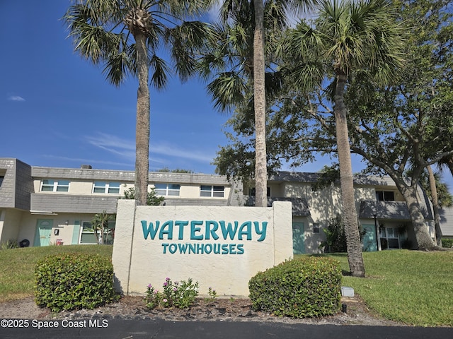 411 Dove Ln Unit 6-11, Satellite Beach, FL 32937 - community sign featuring a yard