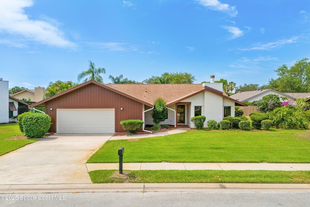 1875 Halifax Ave, Melbourne, FL 32935 - mid-century home with a garage, a front yard, concrete driveway, a chimney, and a shingled roof
