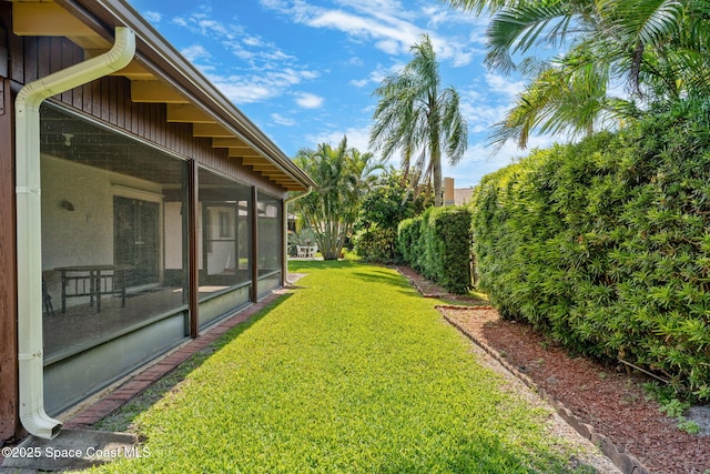 1875 Halifax Ave, Melbourne, FL 32935 - view of grassy yard featuring a sunroom