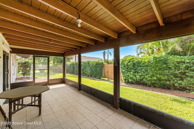 1875 Halifax Ave, Melbourne, FL 32935 - unfurnished sunroom with beamed ceiling